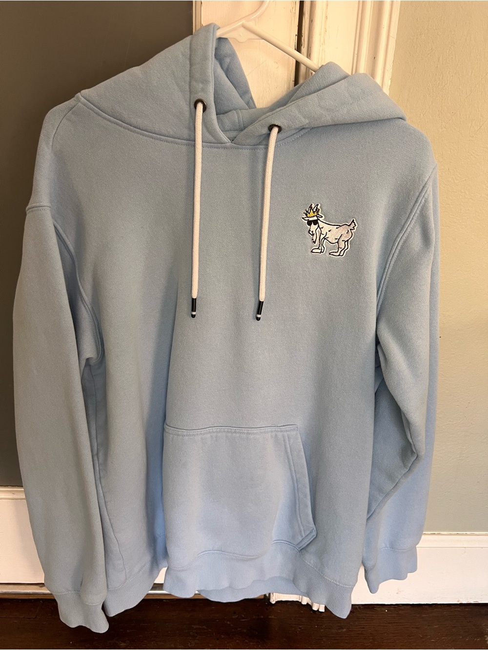 Light Blue Pullover Hoodie with Embroidered Goat Motif